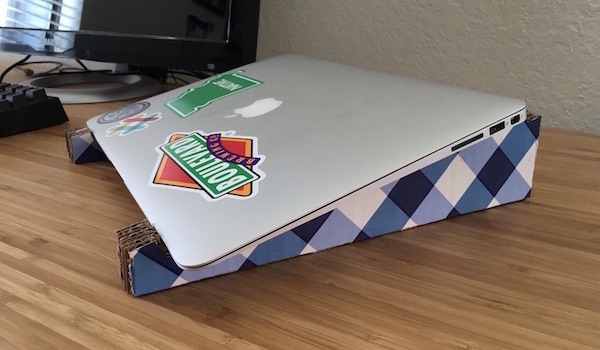 laptop closed sitting on homemade cardboard
